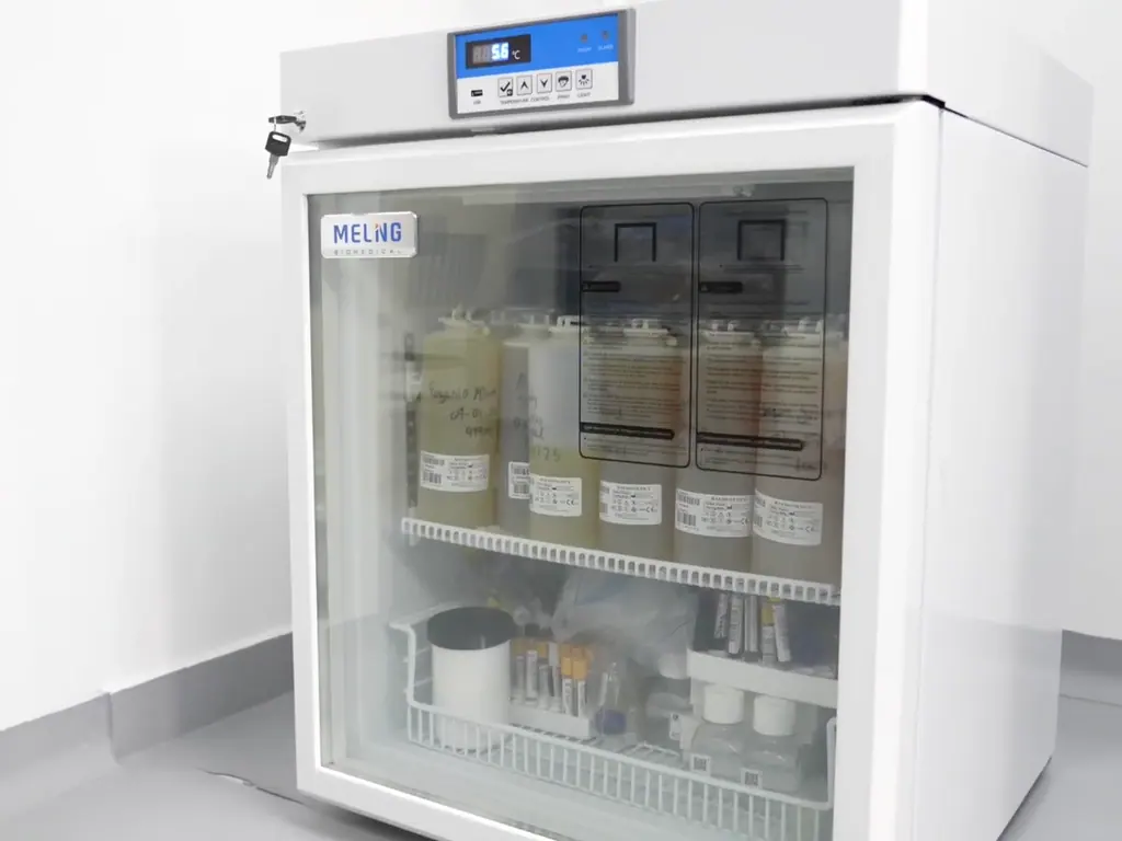 Temperature-controlled cabinet holding labelled biological samples at the site.