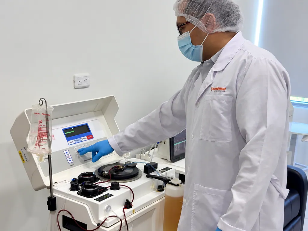 Allied professional operating an apheresis device.